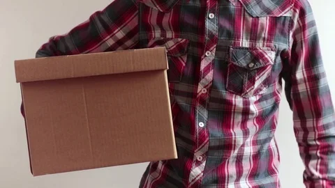 Man with package under arm 動画素材 77294342