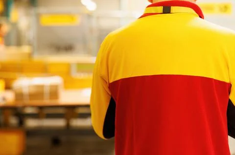 A man packing a package in a warehouse Stock-Fotos