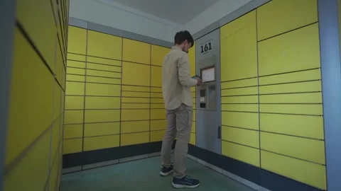 Man at packing station using screen and holding box for self shipment. Parcel Stock Footage 242792141