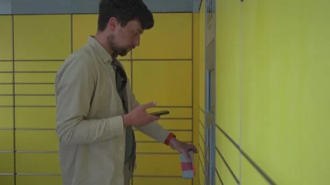Man at packing station using screen and holding box for self shipment. Parcel Stock Footage 242792289