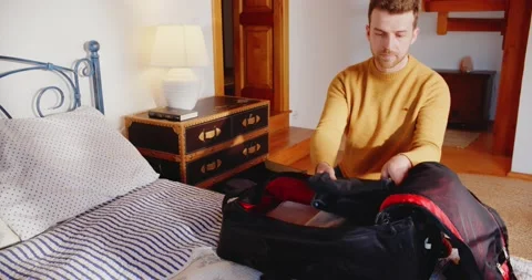 Man Packing Suitcase in a Hurry Running from War Man Ukraine Emmigration Stock-Footage 195286597