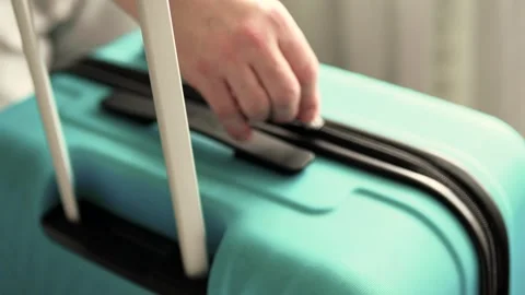 Man packing a suitcase for trip closeup. Travel concept slow motion. Stock Footage 301558178