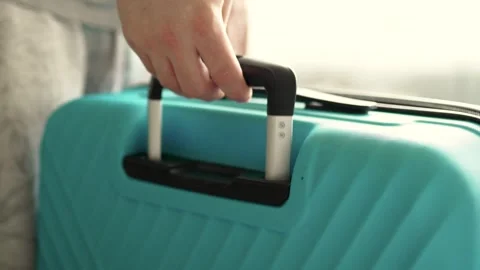 Man packing a suitcase for trip closeup. Travel concept slow motion. Stock Footage 301558207