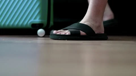 Man packing a suitcase for trip closeup. Travel concept slow motion. Stock Footage 301558225