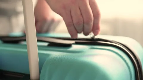Man packing a suitcase for trip closeup. Travel concept slow motion. Stock Footage 301558231