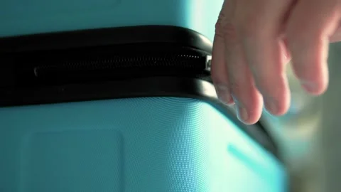 Man packing a suitcase for trip closeup. Travel concept slow motion. Stock Footage 301558476