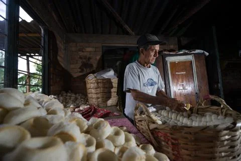 Man packing traditional corn bread tortillas Stock Photos