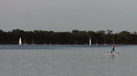 Man on Paddle Board on Lake Stock Footage 65266532
