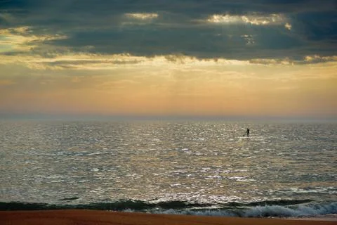 Man with paddle. Stock Photos