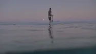Man On Paddleboard At Sunset Stock Footage