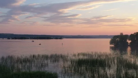 A Man On A Paddleboard Touring On The River Against The Beautifull Sunset Stock Footage 115828524