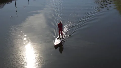 Man Paddleboarding Stock Footage 62934081