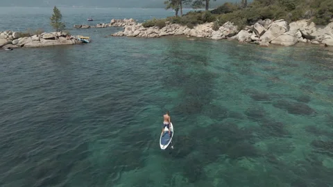 Man paddles on the board Stock Footage 163686392