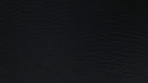 Man Paddles canoe through pristine mountain lake in the Cascades of Washington Stock Footage 111393524