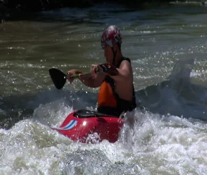Man paddles in Rapids using white-water kayak Stock Footage 21680592