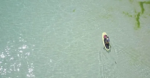 A Man Paddling a Board Stock Footage 75866435