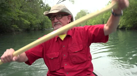 Man paddling a canoe Video stock 54121111