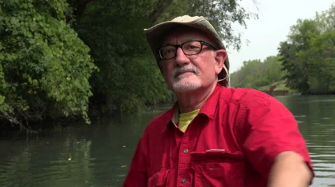 Man paddling a canoe Stock Footage 54124976