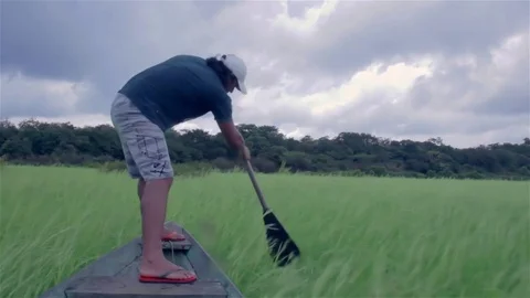 Man paddling on a canoe 動画素材 75172389