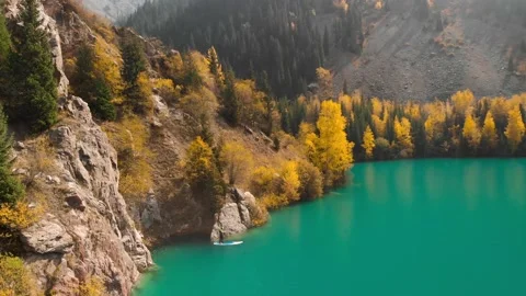 Man is paddling on Sup board in the mountain lake Видео 141056980