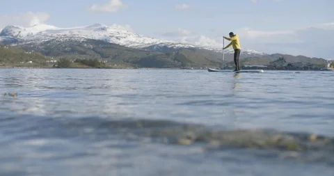 Man paddling SUP on lake Stock Footage 85964978