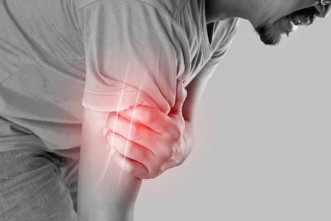 Man with pain in the humerus Stock Photos