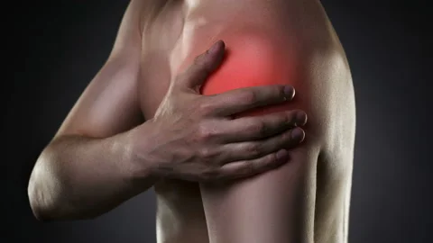 Man with pain in shoulder on black background Stock Footage 86284660