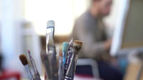 Man painting on canvas in studio Stock Footage 75199678