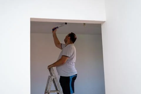 Man painting a ceiling Stock Photos