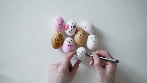 Man painting easter eggs for holiday, easter preparation concept. Stock Footage 181571138