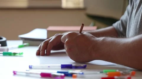 Man painting sitting at the table. Stock Footage 252857701