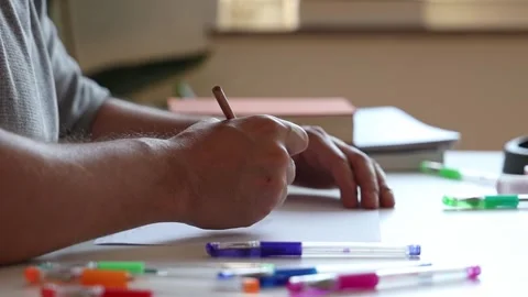 Man painting sitting at the table. Stock Footage 252857789