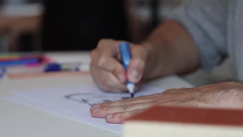 Man painting sitting at the table. Stock Footage 252857876