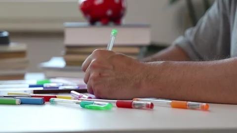 Man painting sitting at the table. Stock Footage 252858107