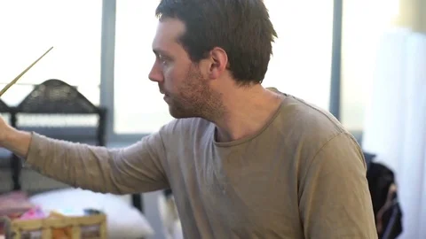 Man painting in studio Stock Footage 75200080