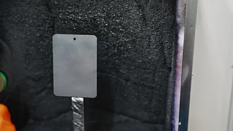 Man paints a card using a spray gun. Human hand and air spray Gun. Mechanic Video stock 263156702