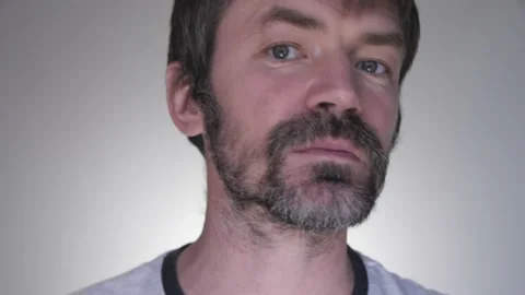 A Man Paints His Gray Beard With Black Ink Stock Footage 132024641