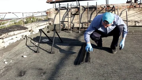 Man paints a metal rack with spray paint Stock Footage 90803250