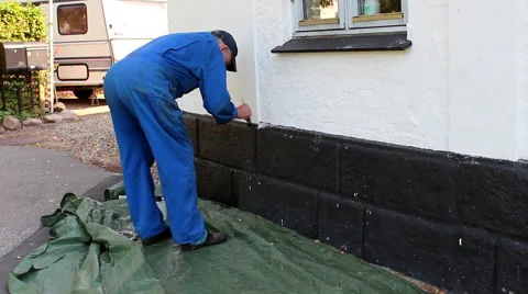 A man paints the socket carefully Video stock 41822396