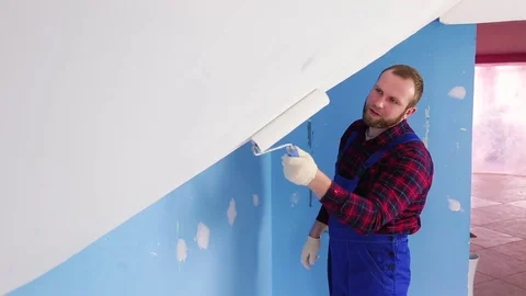 Man paints the wall Stock Footage 75038295
