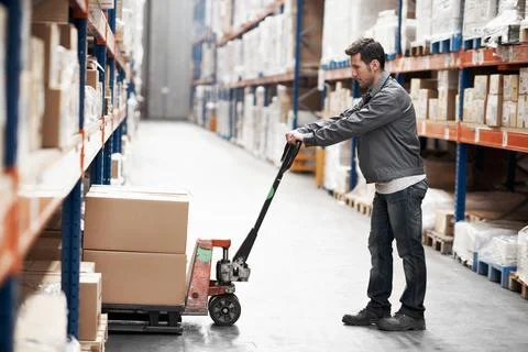 Man, pallet jack or boxes in warehouse for distribution, inventory management or Stock Photos