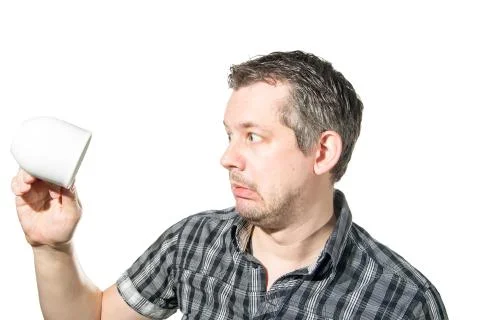 A man in panick because of an emtpy coffee cup Stock Photos