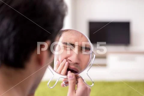 Man panicking because of pimples on the skin Stock Photos