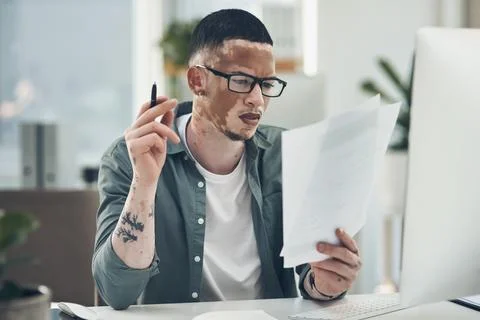 Man, paperwork and problem solving in office with computer, glasses or plan.. Foto stock