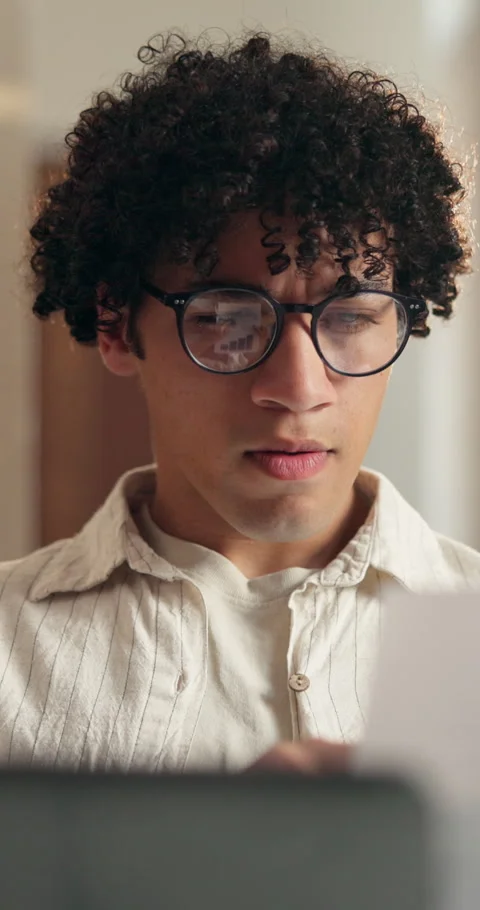 Man, paperwork and remote work with laptop for programming, update and compare Stock Footage 348732228