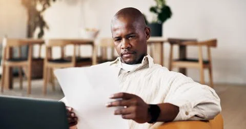 Man, paperwork and remote work in home with laptop, problem solving and review Stock Photos