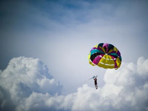 Man with parachute floating Stock Photos