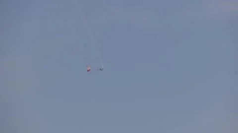 Man parachuting to local beach Stock Footage 197392863