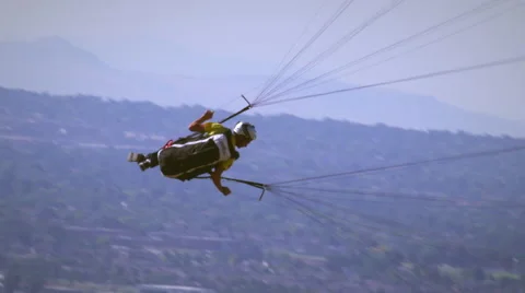 Man paragliding and rotating in the sky from Point of the mountain near Draper, Stock-Footage 52224484