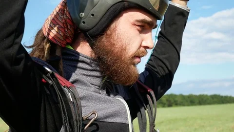 Man Paragliding Moves Smoothly Through The Air Stock Footage 77696244